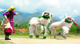 Tibetan artistes present a traditional dance as part of the celebrations in Dharamsala on Sunday.