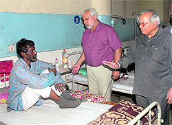 Punjab Health Minister Madan Mohan Mittal interacts with a patient during his visit to the Civil Hospital in Jalandhar on Sunday
