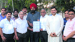 Industrialists show a copy of the memorandum against the steep hike in collector rates they submitted to Local Bodies Minister Bhagat Chunni Lal and Mayor Rakesh Rathour in Jalandhar on Sunday
