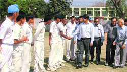 Deputy Commissioner Rahul Tiwari being introduced to players on the inauguration of the cricket academy at the Arya College ground in Ludhiana on Sunday. 