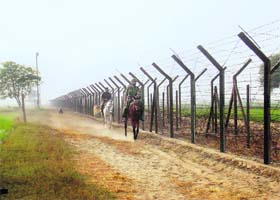 BSF personnel patrol along the border with Pakistan