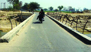 The damaged bridge on the Aspal seepage drain poses a risk to commuters lives. 