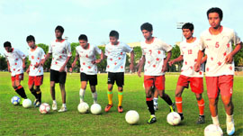 The players of the boys U-16 football team of Chandigarh attend a practice session.