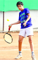 A player returns a shot during the Manav Mangal Total Tennis Championship at Phase X, Mohali, on Monday.