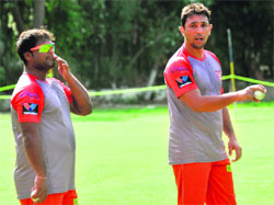 (Right) Former Pakistan player Azhar Mahmood with Romesh Powar practice at the PCA Stadium in Mohali on Monday. 