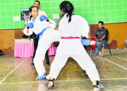Two girl players during a Karate tournament at the Parade Ground in Dehradun.