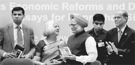 Prime Minister Manmohan Singh being presented a copy of a festschrift entitled Economic Reforms and Development Essays for Manmohan Singh by<P>Isher Judge Ahluwalia and IMD Little in New Delhi on Saturday. Also seen are Raghuram Rajan (extreme left) and RBI Governor D Subbarao (extreme right). 