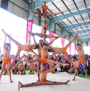 Students present yoga at a function to mark the completion of 100 years of Gurukul in Kurukshetra.