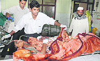 An injured undergoing treatment at the Jalandhar Civil Hospital. 