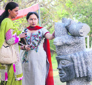 Visitors look at a sculpture during the concluding function of the seven-day All-India Sculptors camp at Kala Kendra in Jammu on Monday.