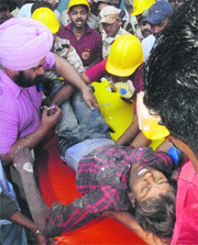 A rescued labourer being taken to a hospital.