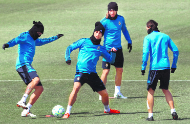 Pepe, Ronaldo, Sergio Ramos and Mesut Ozil during a training session in Madrid on Monday. 