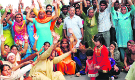 Kin of the deceased hold a protest.