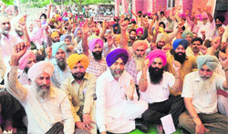 Members of the CTU Workers Union during a protest against UT Administration outside the office of the CTU Director in Industrial Area, Phase 1, in Chandigarh