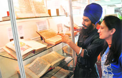 Students take a look at some rare books being exhibited at Panjab University