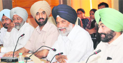 (Right) Surjit Singh Rakhra, rural development and panchayat minister, addresses a meeting in Mohali