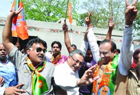 ITS THREE CHEERS FOR BJP: Delhi BJP chief Vijender Gupta dances with supporters in New Delhi on Tuesday