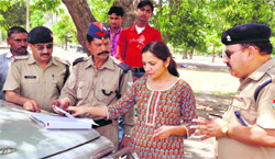 ARTO, Kotdwara, Anita Chamola and SP (traffic), Haridwar, KL Shaw check the papers of vehicles on New Delhi-Dehradun National Highway in Haridwar 