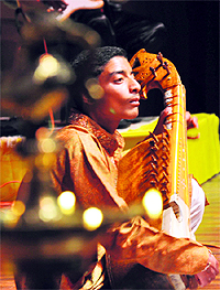 A Kashmiri boy plays the sitar during Choona Hai Aasman in Jammu on Tuesday