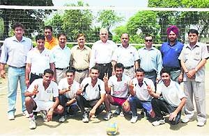 The Physical Education Department team strikes a pose after winning the inter-department tournament in the University of Jammu on Tuesday