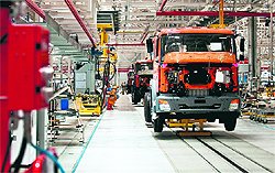 Bharat Benz trucks are seen on the assembly line at the Daimler India Commercial Vehicles plant at Oragadam in Chennai on Wednesday. The factory will begin production in the third quarter with an initial capacity of 36,000 vehicles per year