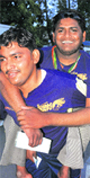 A man carries his physically challenged friend on his back