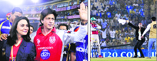 Shah Rukh Khan and Preity Zinta at the PCA stadium on Wednesday. Tribune photo: Pradeep Tewari and A securityman runs to catch hold of an intruder.