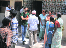 Residents gather outside houses during a CBI raid at Sector 30 in Chandigarh on Wednesday.