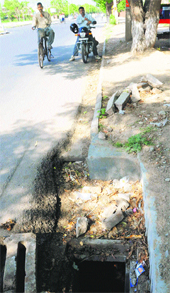 An open stormwater pipe manhole. 