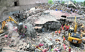 Teams of the NDRF, the Army, NGOs and religious organisations carry out rescue operation at the factory collapse site in Jalandhar on Wednesday