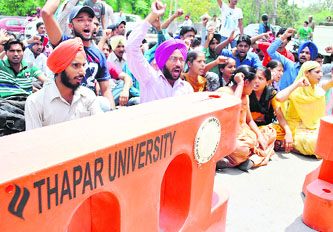 Members of the Punjab Students Union hold a protest in front of Thapar University in Patiala on Wednesday. Tribune photo: Rajesh Sachar
