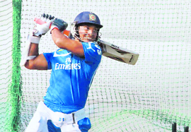 Deccan Chargers skipper Kumar Sangakkara plays a shot during a practice session. 