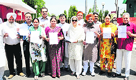 BJP-SAD councillors show their resignation letters at the Punjab Governor House in Chandigarh on Thursday. 