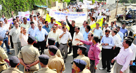 Members of the Uttarakhand Diploma Engineers Association take out a procession in support of their demands in Dehradun on Thursday.