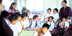 Students of Delhi Public School interact with the students of Bajaja Institute of Learning in Dehradun on Thursday.