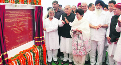 Union Minister for Road Transport and Highways CP Joshi inaugurates the first RFID technology-based electronic toll plaza at Chandimandir, Panchkula, on Thursday amidst clapping by the Haryana and Punjab Chief Ministers.
