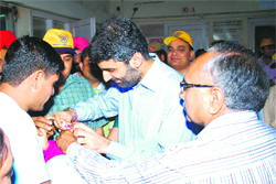 Deputy Commissioner Mandip Singh Brar (centre) administers polio drop to a child on the inaugural day of the three-day polio campaign on the premises of LNJP Hospital in Kurukshetra. 