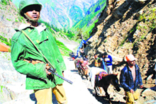 A soldier stands guard as pilgrims head for the Amarnath cave shrine in south Kashmir.