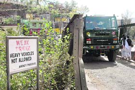Oblivious to the warning, heavy vehicles continue to ply on Hamilton Bridge over the Gurdan Nullah in Rajouri