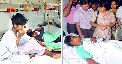Injured labourer Sanjiv; and (right) Principal Secretary, Health, enquires about the health of another labourer at the Civil Hospital in Jalandhar. Both the labourers are juveniles