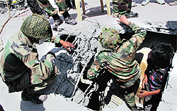 Army jawans during a rescue operation at the Shital Fibres factory collapse site in Jalandhar on Thursday