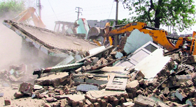 An MC team carries out a demolition drive in Ludhiana on Thursday.