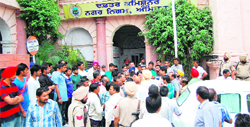 BJP and SAD workers hold a protest outside the Municipal Commissioners office in Amritsar