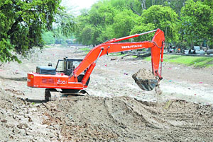 A Poclain machine cleaning the Sirhind canal on Friday.