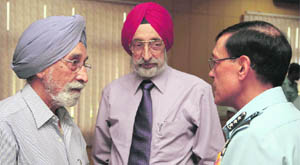 Air Marshal DC Kumaria, AOC-in-C, Western Air Command (right), interacts with Air Cmd (retd) Jasjit Singh (centre) during a CAPS seminar held at Air Force Station, Chandigarh, on Friday. 