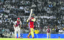 Royal Challengers Bangalores Chris Gayle hits a straight six to Harmeet Singh of Kings XI Punjab in Mohali 