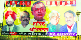 Illegal hoarding greeting the leader of the Opposition in Rajya Sabha Arun jaitely at Rialto Chowk in Amritsar on Saturday.