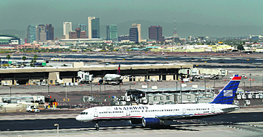 A US Airways airplane rolls along the tarmac at Sky Harbor International Airport in Phoenix, Arizona. As American Airlines continues through bankruptcy US Airways is working on a possible deal to take over the troubled airline. The latters three main unions have reached a tentative deal with US Airways Group intended to put pressure on a reluctant American to start merger talks with its rival, the unions and US Airways said Friday.