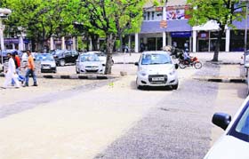 A car parked on a pedestrian path in Sector 17, Chandigarh