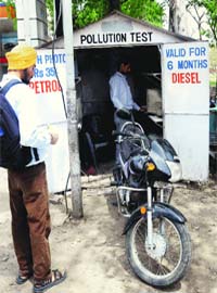 A motorcycle being checked at a pollution check centre in Chandigarh on Saturday